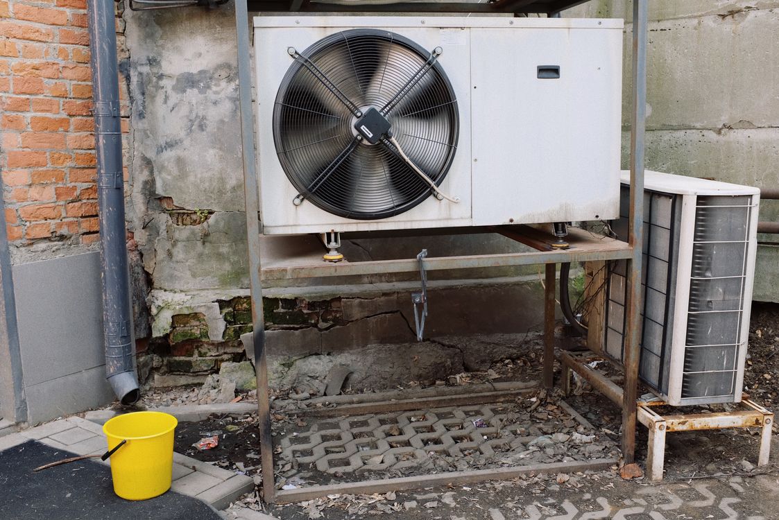 HVAC crew installing condenser unit — HVAC field service platform tracks every installation stage